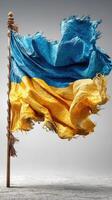 Flag of Ukraine waving boldly in a dynamic display of colors and texture against a neutral background photo
