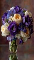 Colorful floral bouquet arranged in a glass vase showcasing roses and freesias indoors photo