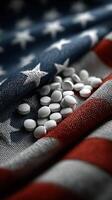 White pills scattered on an American flag symbolizing health and national issues in a focused composition photo