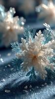 Frosted snowflakes sparkle on a blue surface, creating a magical winter atmosphere and capturing the essence of the season photo