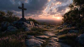 Scenic sunset view with a cross on a hilltop, surrounded by lush greenery and rocky landscape photo
