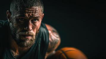 Intense basketball player focused on the game, showcasing determination and sweat during training photo