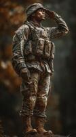 Soldier saluting in the wilderness during a training exercise in a forested area photo