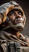 Soldier saluting under harsh conditions during a military operation in a desert environment photo