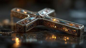 Beautifully crafted ornate cross with intricate details and soft lighting displayed on a dark surface photo