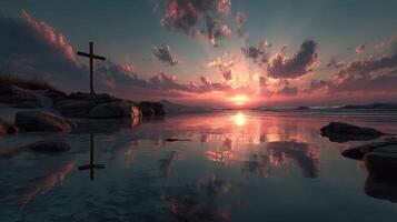 Beautiful sunset over coastal waters with a cross silhouette and dramatic clouds reflecting in the calm sea photo