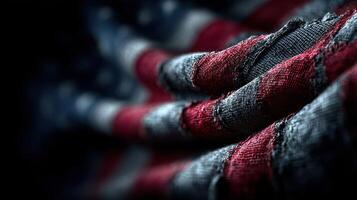 Worn American flag beautifully draped showing rich colors and textures in soft light photo