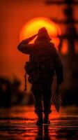 Soldier saluting the sunset with an American flag during a solemn moment near a naval ship photo