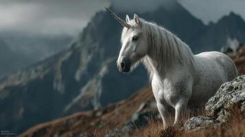 Majestic unicorn standing on rocky terrain with mountains in the background and cloudy skies above at twilight hour photo