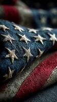 Close-up view of vintage American flag fabric showcasing stars and stripes with rich textures and colors photo