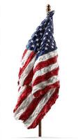 Worn American flag draped over a wooden pole in a studio setting showcasing patriotism and history photo