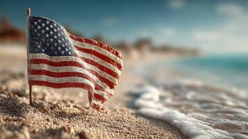 Waving flag on sandy beach with gentle waves and blurred shoreline background during sunny day photo