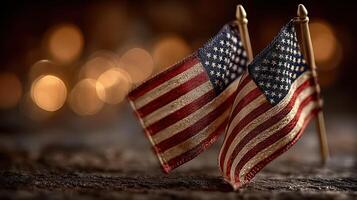 Miniature American flags displayed together on a rustic surface with warm bokeh background for a patriotic celebration or event photo