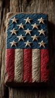Intricate wooden carving depicting the American flag with stars and stripes design on a rustic surface photo