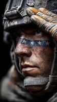 Soldier saluting with patriotic face paint during a military training exercise at sunset photo