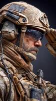 Military soldier in protective gear salutes while covered in dust in an intense moment of dedication photo