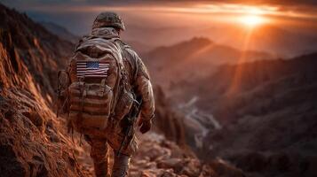 Soldier walks through rugged terrain at sunset showcasing determination and resilience in challenging environment photo