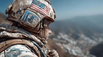 Soldier in camouflage observes the landscape from a high vantage point on a clear day photo