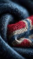 Intricate texture of woven fabric in red, blue, and beige colors showcased in a close-up view photo