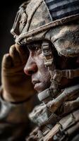 Soldier saluting during a military ceremony in a dusty environment at twilight photo