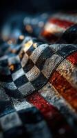 Textile featuring a vibrant mix of dark and light tones with a checkered pattern and red, white, and blue colors photo