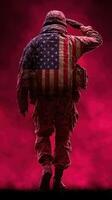 Soldier saluting with American flag representation in a dramatic red background at twilight photo