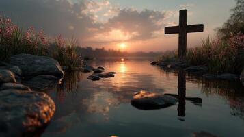 Peaceful sunset over a calm lake with a wooden cross and wildflowers photo