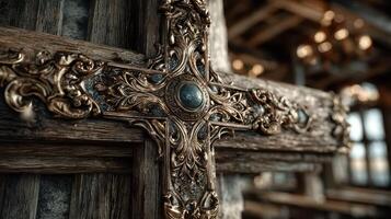 Decorative wooden cross with intricate carvings and embellishments inside a historic building photo