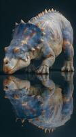 Dinosaur model in vibrant colors with intricate details reflected in a shiny surface during a studio showcase photo