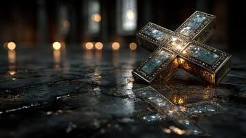 Intricately designed cross resting on a reflective surface in a softly lit religious setting photo