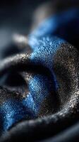 Close-up of textured fabric showcasing intricate patterns in deep blue and black hues photo