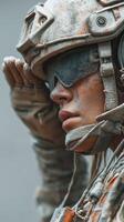 Soldier in tactical gear saluting during a dusty military operation in a desert environment at sunset photo
