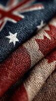 Textiles displaying American and Australian flags with rich colors and textures folded together in close-up photo
