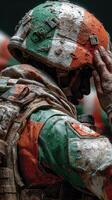 Soldier in camouflage uniform saluting during a military ceremony in a training ground photo
