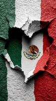 Heart-shaped crack reveals the Mexican flag on a textured wall during a celebration of culture and pride photo