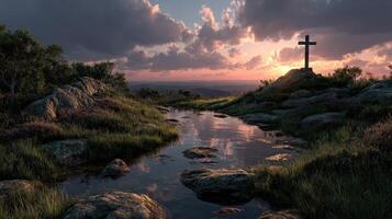 Rocky landscape with a cross at sunset reflecting on still water near a rural area photo