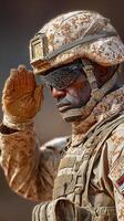 Soldier salutes during military ceremony in sandy terrain under bright sunlight in a desert environment photo