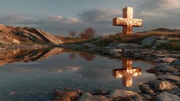 Glowing cross reflection in serene landscape during golden hour at a tranquil outdoor setting photo