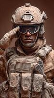 Soldier in dusty gear saluting with determination during a challenging mission in an arid environment photo