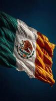 Wave of pride in the vibrant colors of the Mexican flag flowing against a dark backdrop photo