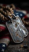 Worn military dog tags resting on a vintage American flag display on a rustic surface photo