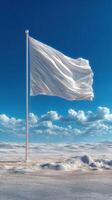 White flag waving in a vast desert landscape under a blue sky with fluffy clouds during daylight hours photo