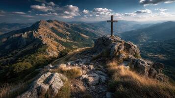 Majestic mountain view with a cross at sunset in an elevated landscape photo