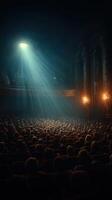 Spectators gather in a grand theater illuminated by dramatic light beams during a captivating performance at night photo