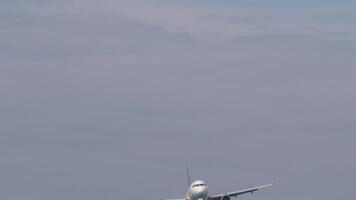 Jet passenger plane descent landing, bottom view. Concept of air travel and commercial aviation video
