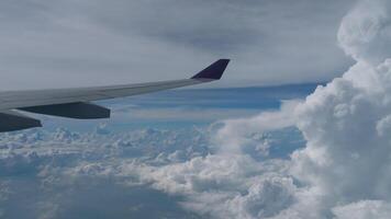 Beautiful cloudscape from airplane window during flight. Travel concept video