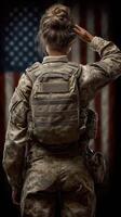 Soldier saluting with respect in front of American flag showing dedication and honor to service photo