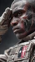 Soldier saluting in a winter landscape with battle face paint and textured uniform during a solemn moment of remembrance photo