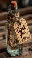 Thank you bottle with a rustic tag placed on a wooden surface creating a warm and inviting atmosphere photo