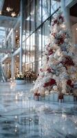 Festive Christmas tree decorates modern atrium with elegant holiday lights in city center photo